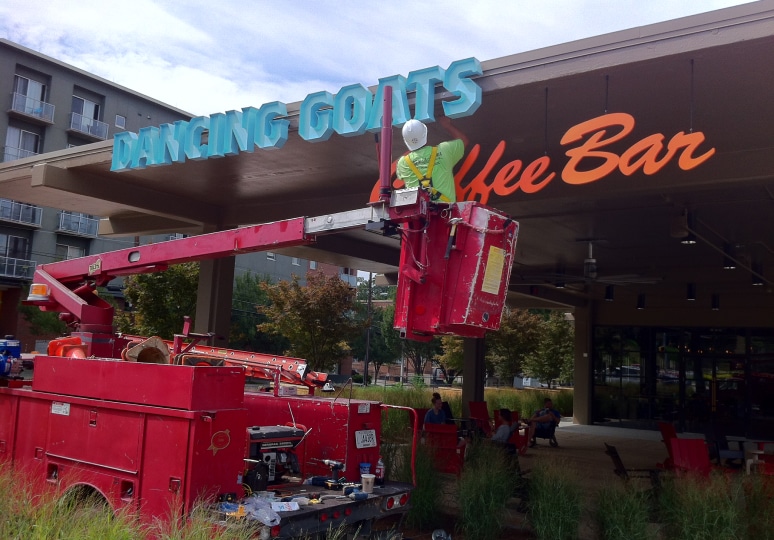 Installing Dancing Goat’s signage